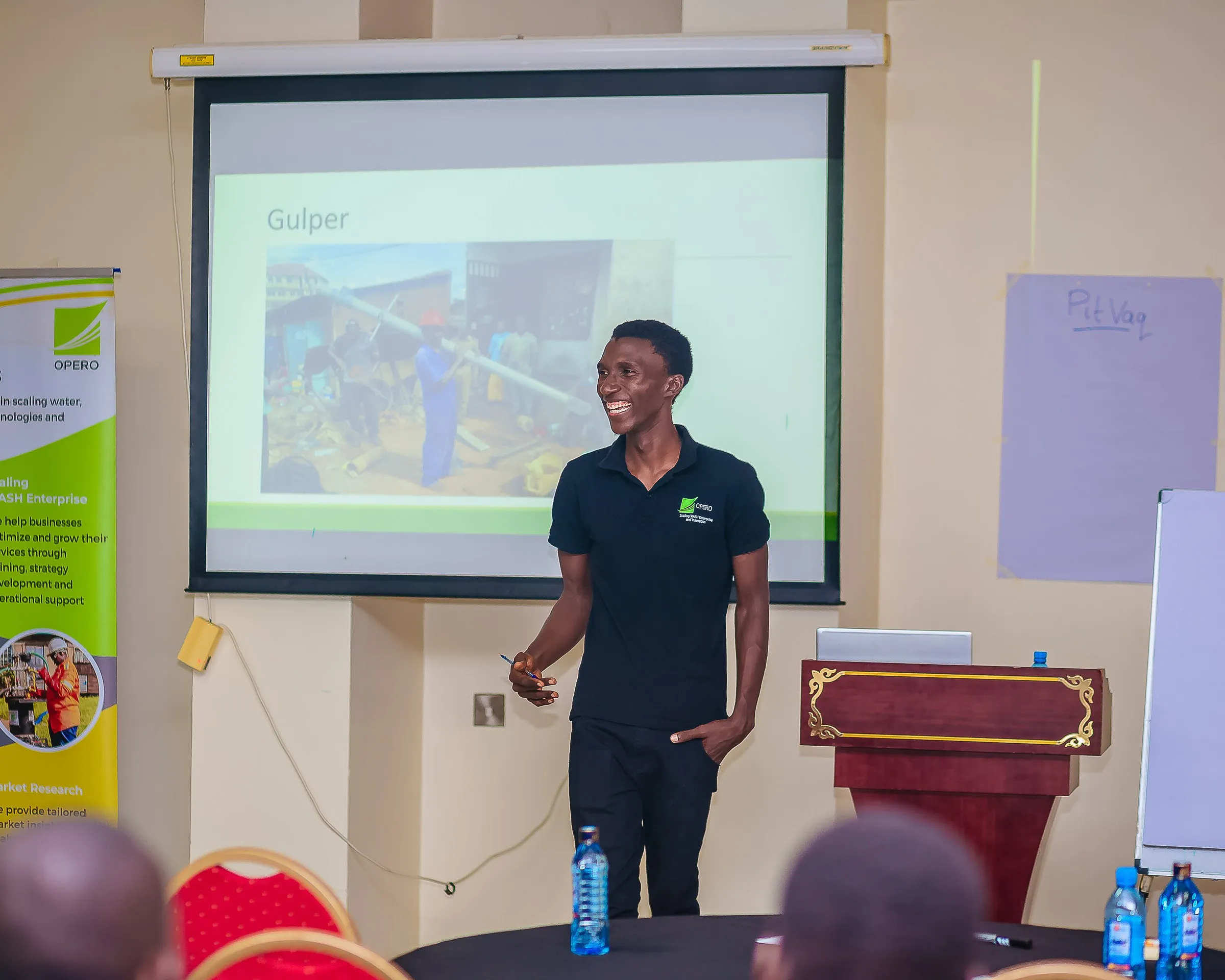 Opero trainer presenting the Gulper during sanitation training